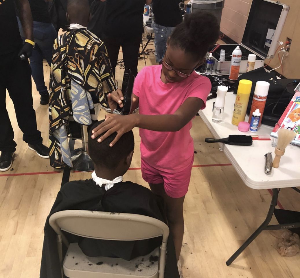 8-year-old girl passes barber training, gives back to community with free haircuts